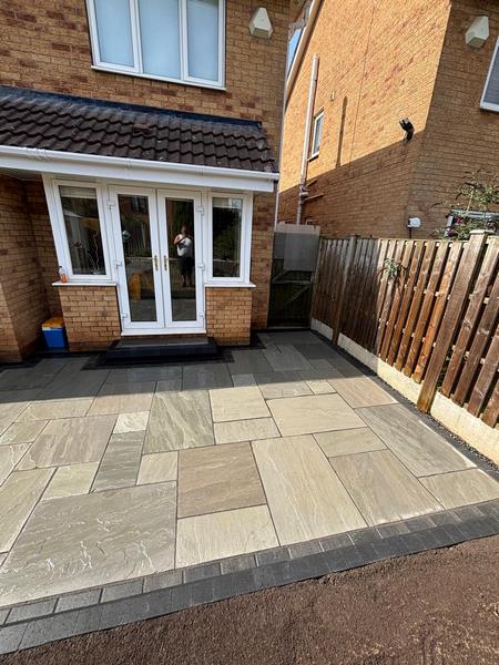 garden transformation natural stone patio charcoal paved border with new steps and channel drainage carlton barnsley 07