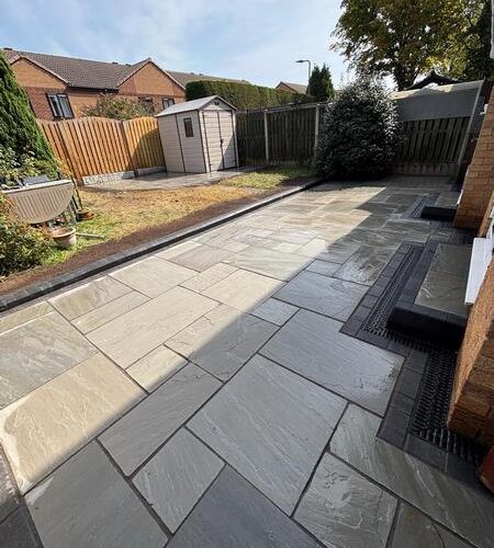 garden transformation natural stone patio charcoal paved border with new steps and channel drainage carlton barnsley 09